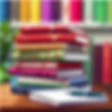 A stack of inspiring books with a notebook and pen