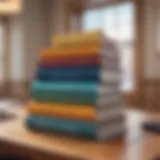 A stack of investment books on a wooden table